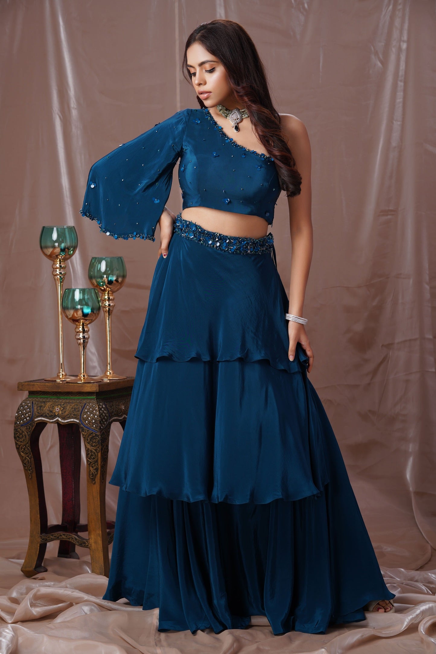 Teal Blue Layered Lehenga With A One Shoulder Blouse