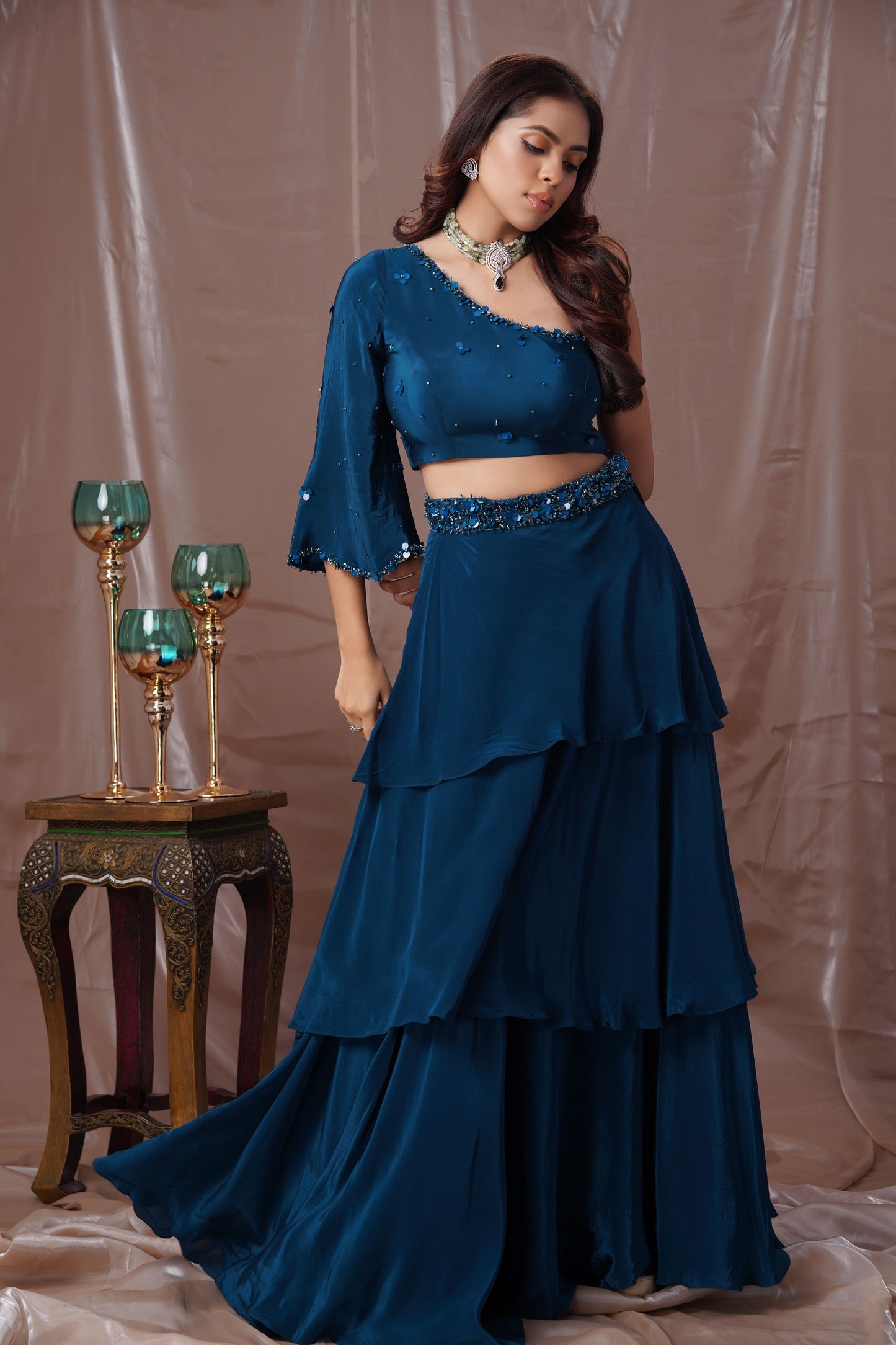 Teal Blue Layered Lehenga With A One Shoulder Blouse