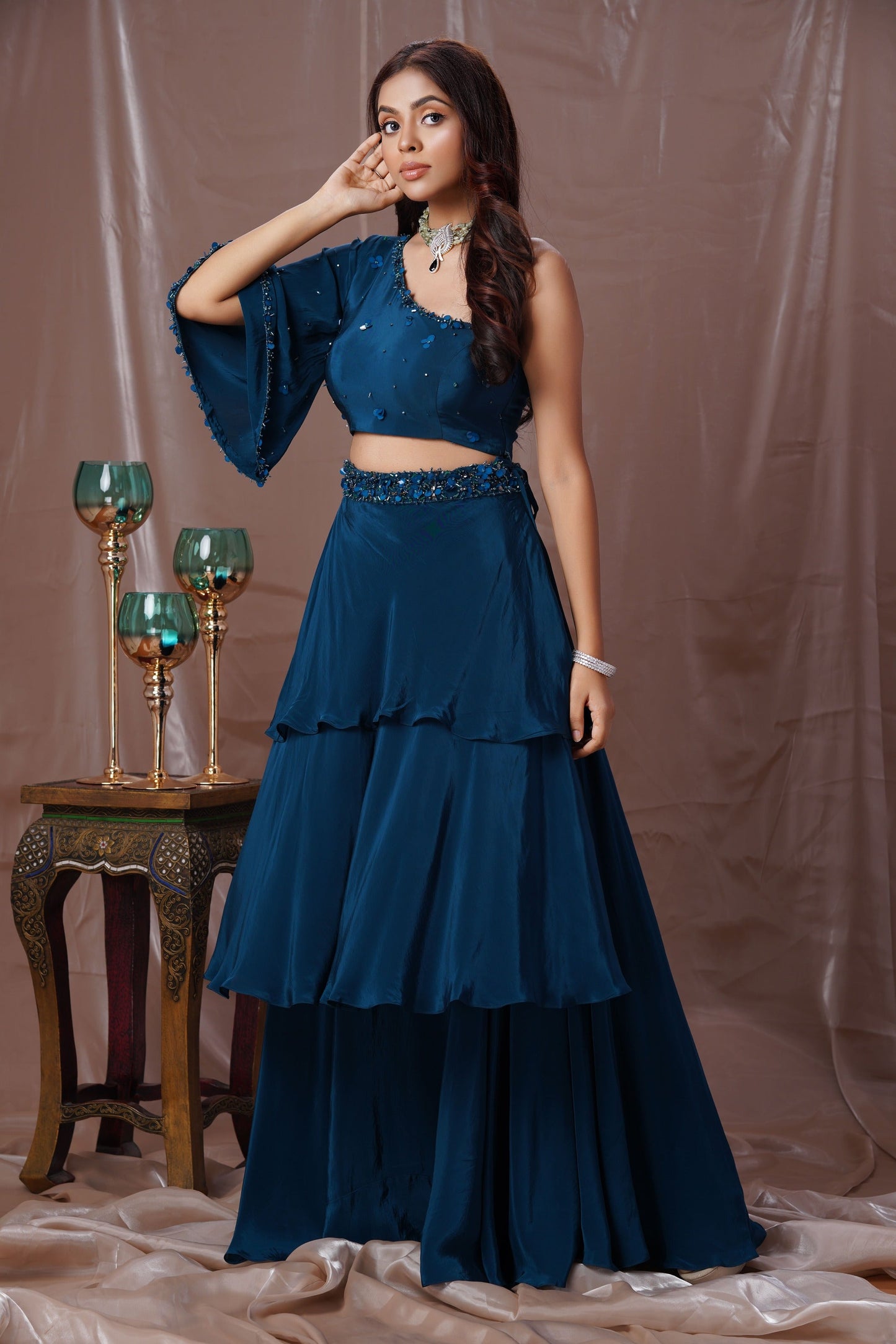 Teal Blue Layered Lehenga With A One Shoulder Blouse