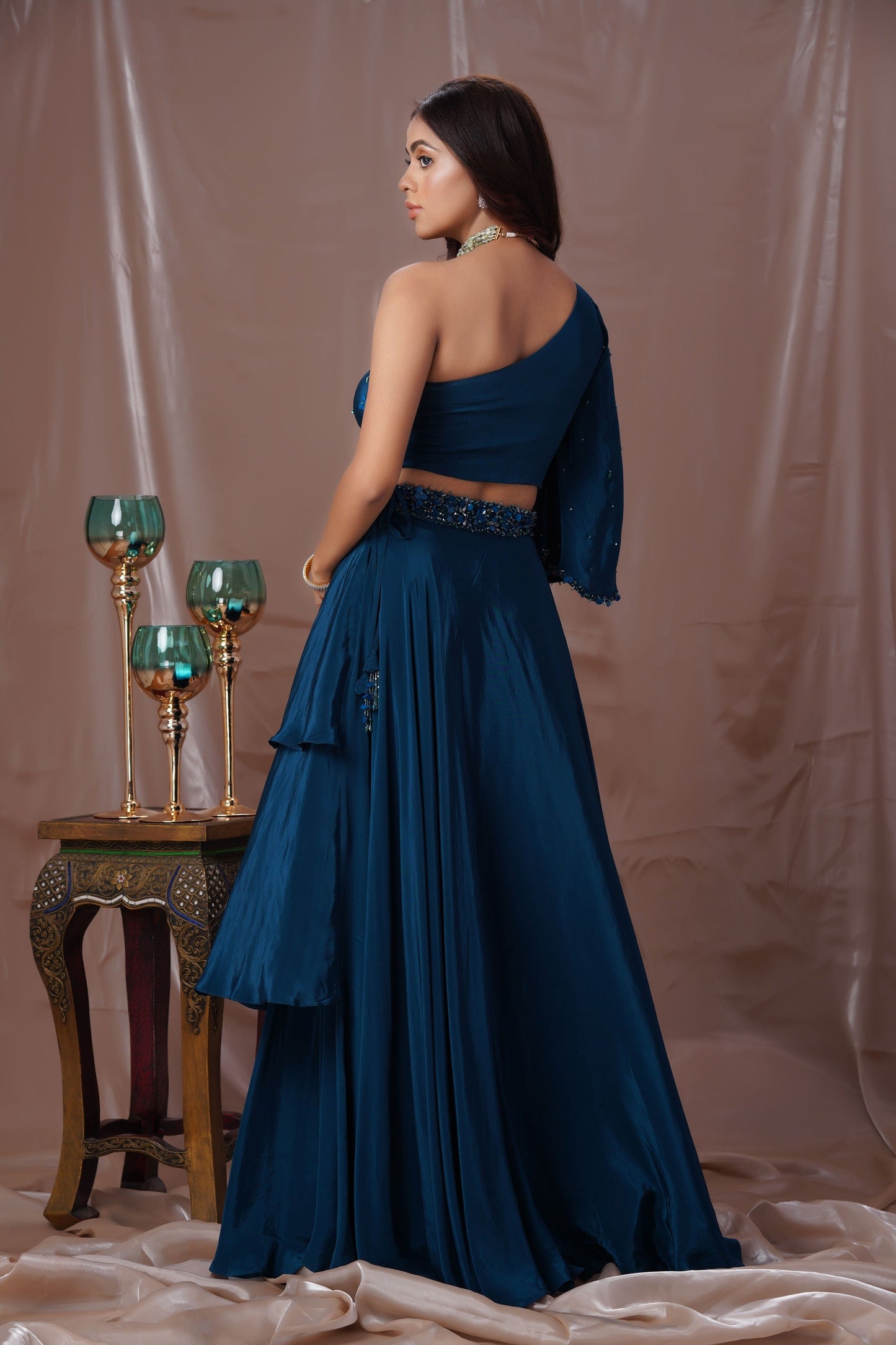 Teal Blue Layered Lehenga With A One Shoulder Blouse